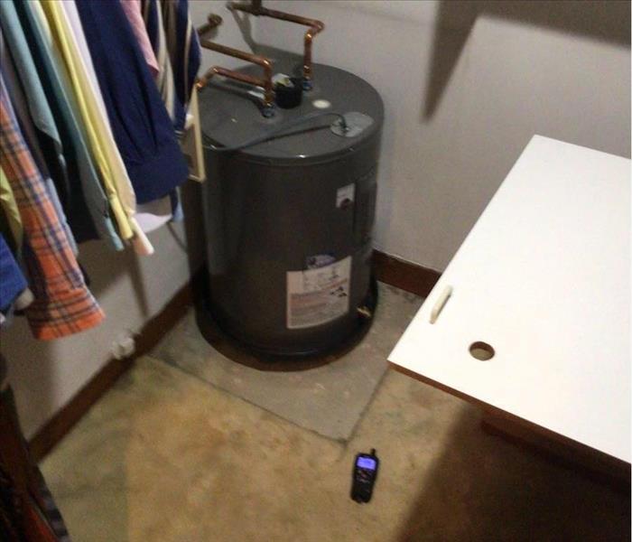 Water heater leak in master closet area of a Pembroke Park home